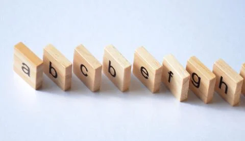 Alphabet on a white table. Stock Photos