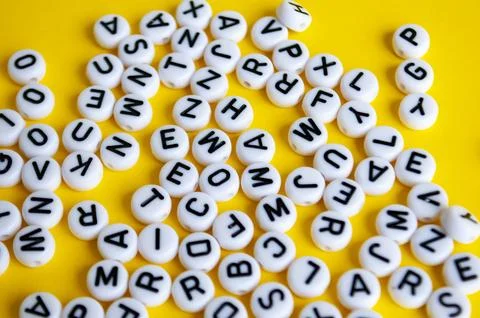 Alphabets on yellow background. Study and education concept Stock-Fotos