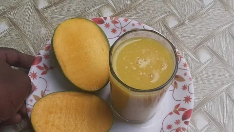 Alphonso mangoes, also known as Hapus, are celebrated for their vibrant saffron Stock Footage 310430540