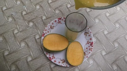 Alphonso mangoes, also known as Hapus, are celebrated for their vibrant saffron Stock Footage 310431457