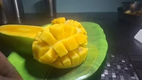 Alphonso mangoes, also known as Hapus, are celebrated for their vibrant saffron Stock Footage 310820556