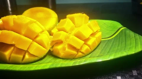 Alphonso mangoes, or Hapus, are prized for their golden-yellow skin Stock Footage 310826638