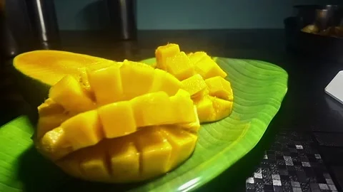Alphonso mangoes, or Hapus, are prized for their golden-yellow skin Stock Footage 310826639