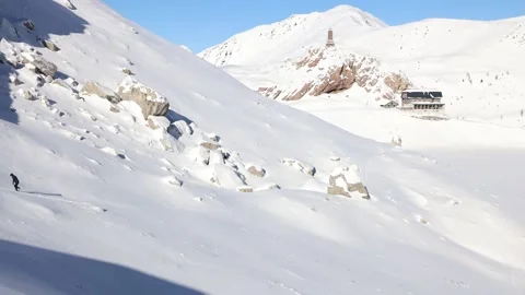 Alpine climber walking hardly to the summit in the snow Stock Footage 239353134