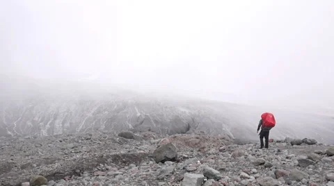 Alpine climber walking towards glacier Stock Footage 43248848