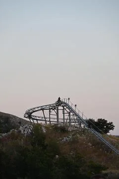 Alpine coaster on a mountain top at dusk Stock Photos