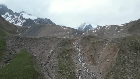 Alpine glacier stream on the trail to Titov Lake, Kazakhstan Stock Footage 340452342