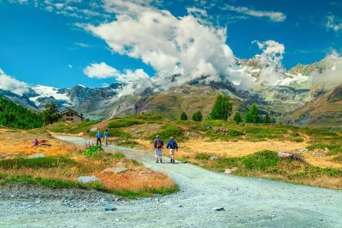 Alpine hiking trails with active backpacker hikers, Zermatt, Switzerland, Eur Stock Photos