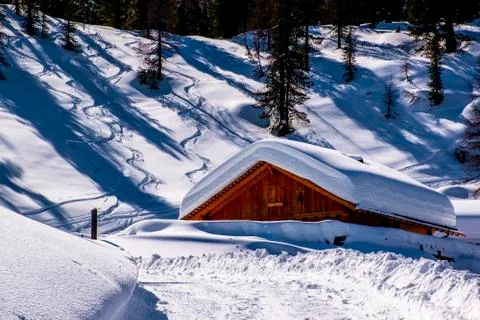 Alpine hut in the snow Stock Photos