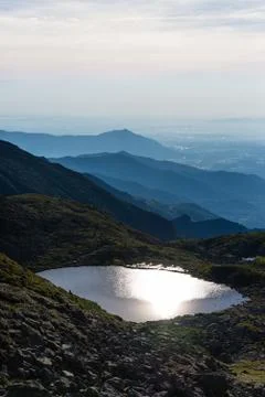 Alpine lake in backlit Stock Photos