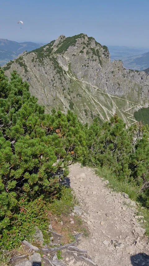 Alpine lake below rugged peaks in the Allgäu Alps near Oberstdorf, Germany Stock-Footage 346368076