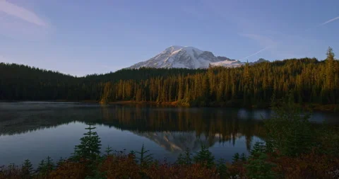 Alpine lake with mountain in background Video stock 162650191