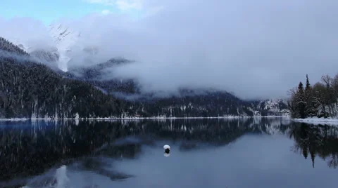 Alpine Lake Ritsa in winter under gloomy clouds, Abkhazia. Full HD Video stock 59113046