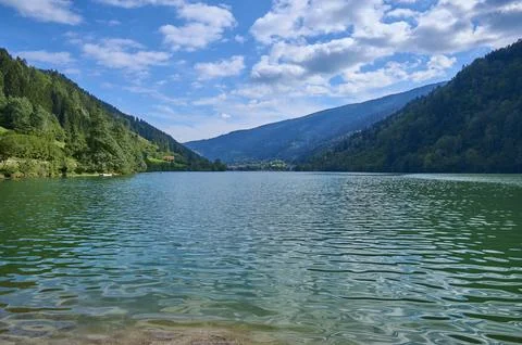 Alpine lake sky clouds summer Afritz am See Villach Carinthia Austria Europe 스톡 사진