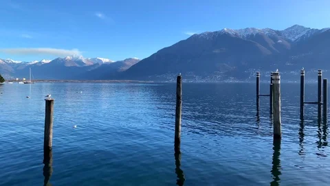 Alpine Lake with Snow-capped Mountain Vídeos de archivo 111574076