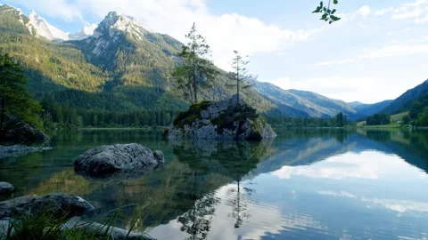 Alpine lake with trees, and mountain reflection. Stock Footage 305862809