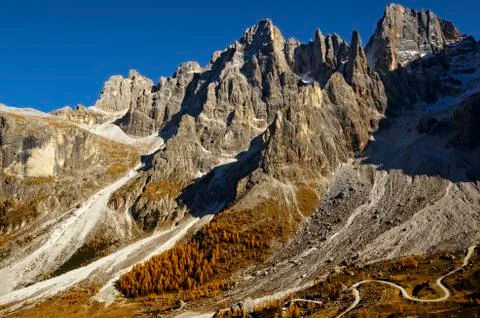 Alpine landscape on Pale San Martino (Dolomites) with scree, larches in autumn Stock Photos