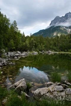 Alpine landscape reflection on a lake Stock Photos