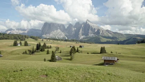 Alpine landscape of Seiser Alm with mountain huts on meadow Stock Footage 150408161