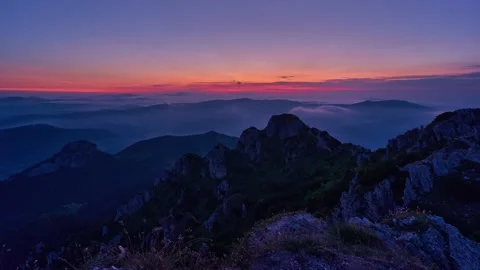 Alpine landscape at sunrise. The first rays of the sun illuminate the rock Stock-Footage 169973410