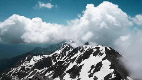 Alpine Majesty: Snow-Capped Mountain Range Panorama Video stock 339271370