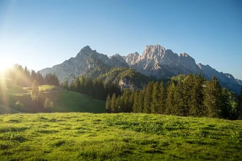 Alpine meadow in front of an idyllic mountain backdrop Stock Photos