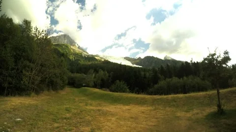 Alpine meadow with lonely tree on the frond and clouds 스톡 동영상 52562625