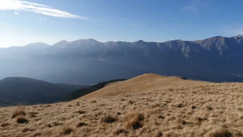Alpine meadow overview with mountains in the background Video stock 168665024