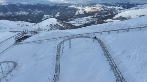 Alpine mountain coaster track on snowy slopes of Bakuriani, Georgia Stock Footage 325992214
