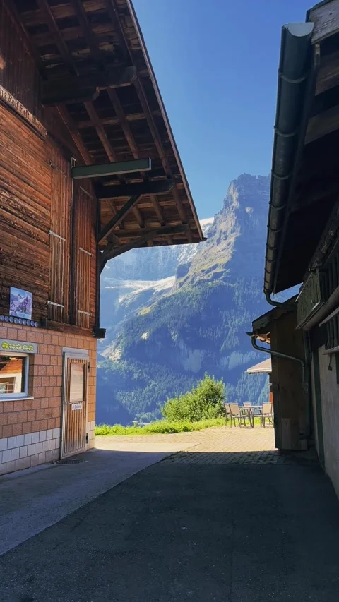 Alpine Mountain Framed Between Swiss Houses Stock Footage 329250444