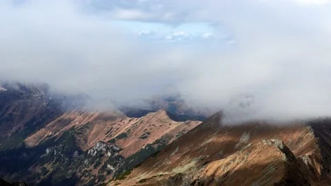 Alpine mountain landscape from the heights, thick clouds above the mountain Stock Footage 221015781