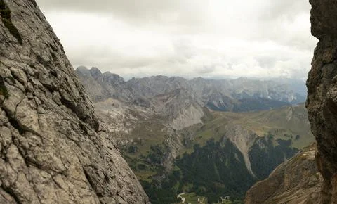 Alpine mountain panorama framed by limestone cliffs in Dolomites mountains .. Stock Photos