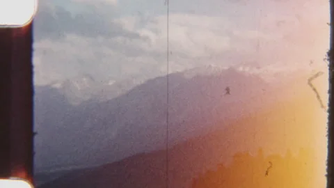 Alpine Mountain Range Covered In Clouds And Light Haze Stock Footage 322132830
