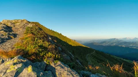 Alpine Mountain Range Gets Slowly Covered in Shadows During Sunset Stock Footage 146688827