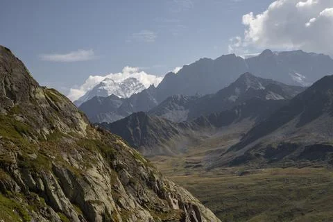 Alpine mountain range with glaciers and sunny sky Stock Photos