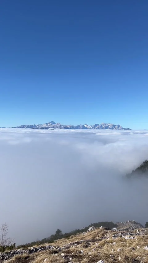 Alpine mountains above clouds, Slovenia Stock Footage 335223079