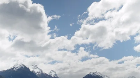 Alpine mountains and green fields, tilt down camera move Stock Footage 89572943