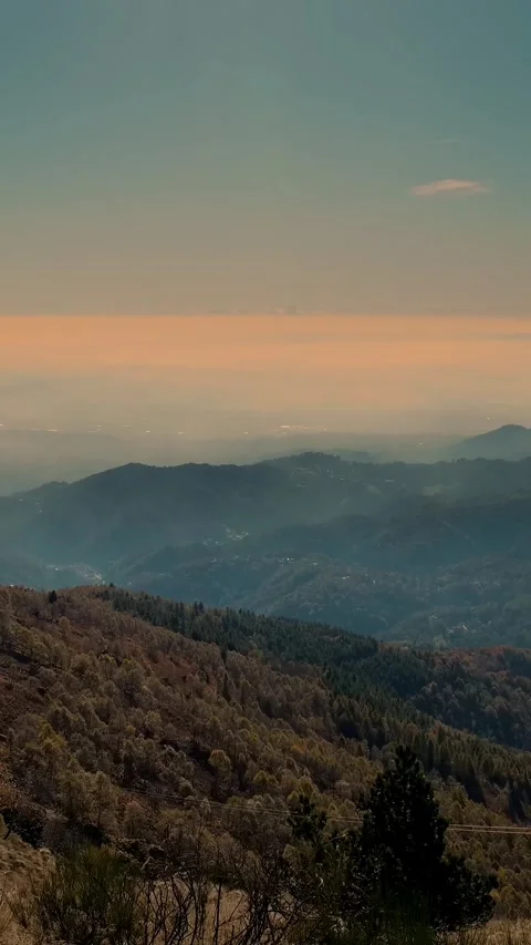 Alpine mountains at dawn. Timelapse. Small clouds, thick fog over the mountains. Stock Footage 310405384