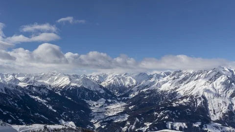 Alpine mountains in winter panning time lapse Stock Footage 104523124