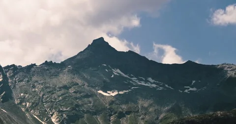 Alpine peak timelapse with glacier shadows and moving clouds in the Italian Alps Stock Footage 319189604