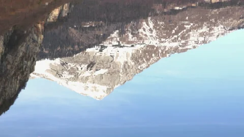 Alpine Peak - Vertical Reflection in Lake Water in Winter Video stock 167735306