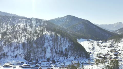 Alpine ranges with forested slopes glimmer under sunlight Stock Footage 321772754
