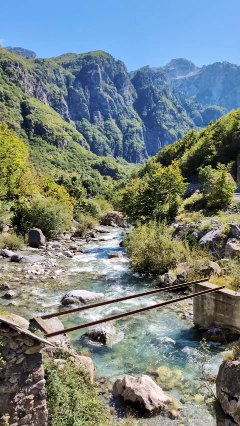 Alpine river flowing through Theth National Park in the Albanian Alps Video stock 335637187