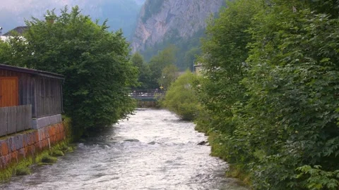 The Alpine River flows through the town of Hallstatt. Stock Footage 279420060