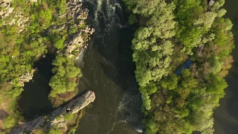 Alpine river seen from above. In summer the river gets thicker due to the tha Видео 130513016
