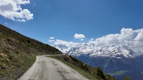 Alpine road leading to Grand Combin mountains Verbier Switzerland Stock Footage 336302750