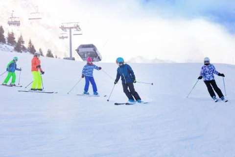 Alpine ski class, group of kids on mountain slope Stock Photos