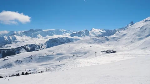 Alpine ski resort bathed in vivid sunlight and clear blue atmosphere Stock Footage 323226871
