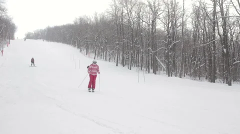 Alpine skier skiing downhill in forest 스톡 동영상 59711910