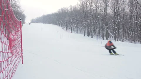 Alpine skier skiing downhill in forest 스톡 동영상 59711953